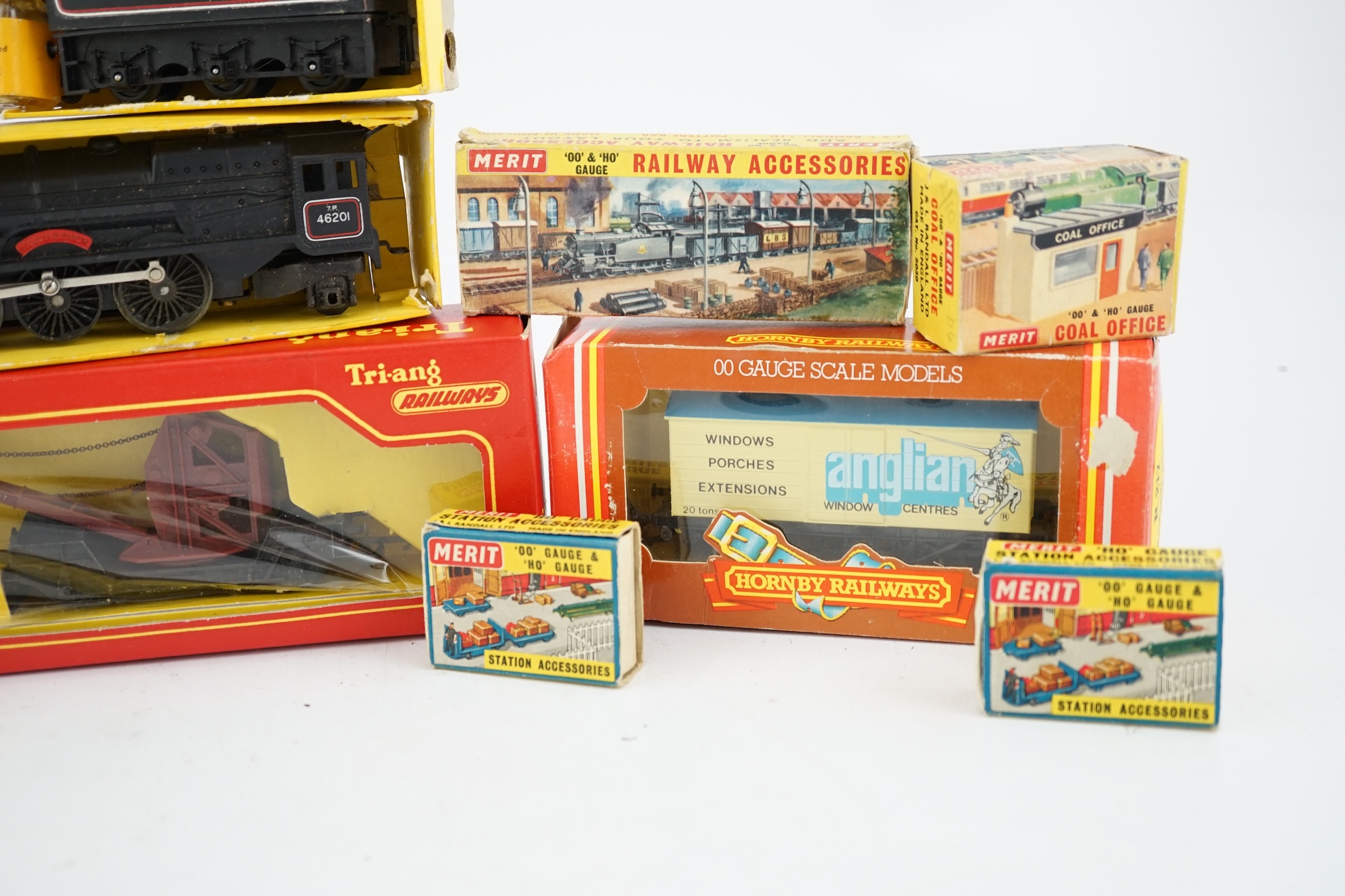A collection of mostly Tri-ang Railways 00 gauge model railway, including three locomotives; a BR saddle tank loco (R153), a BR Princess Royal class 4-6-0 and an S.R. Suburban Motor Coach driving unit